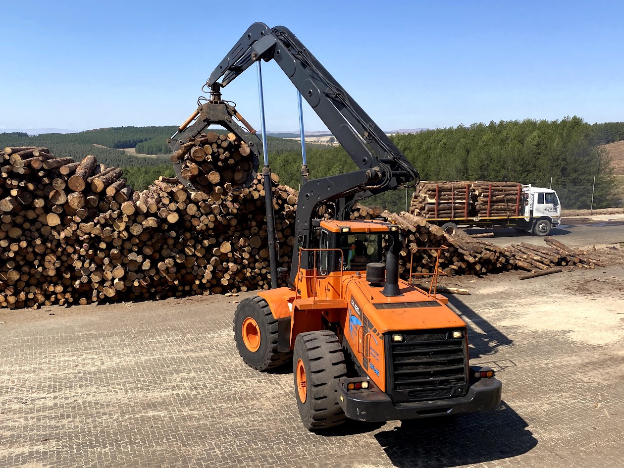 Custom-engineered high-lift log loader in operation